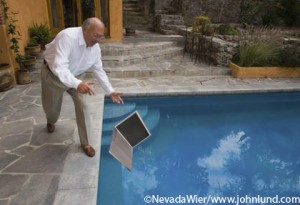 Man Drops Laptop into Pool